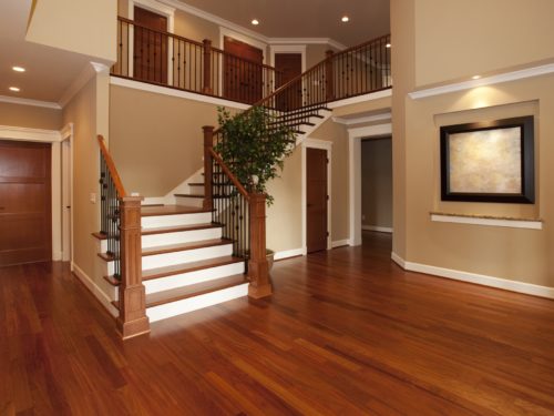 Wood flooring in a large house with stairs